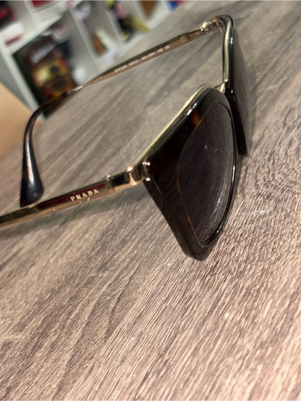 Prada Women’s Black Lensed Sunglasses with Gold Trim Prada Cinema SPR 53S